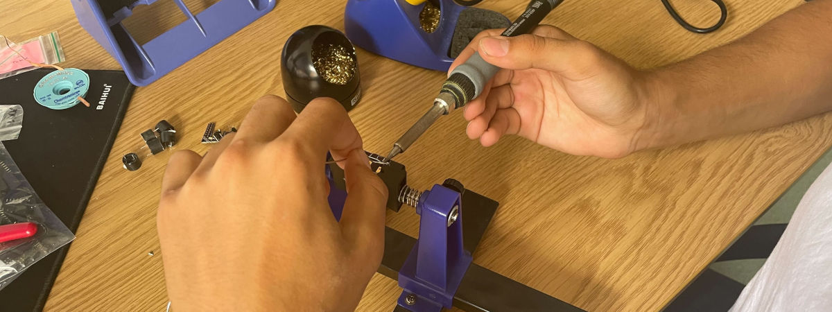 Close-up soldering and assembling PCB